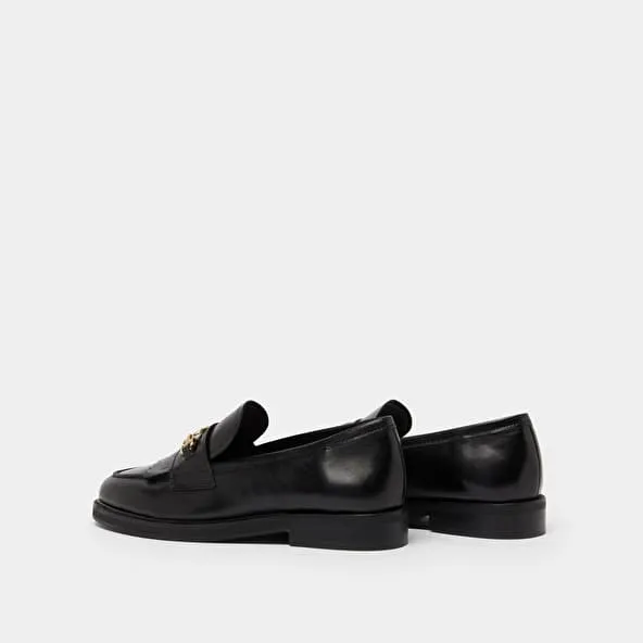 Loafers with gold buckles in black leather