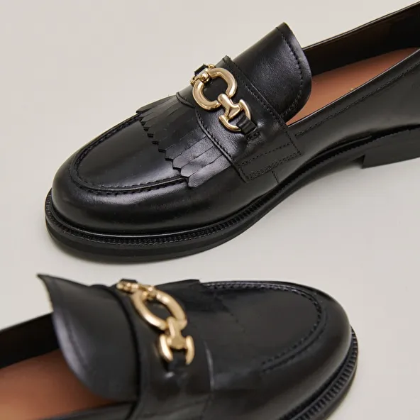 Loafers with gold buckles in black leather